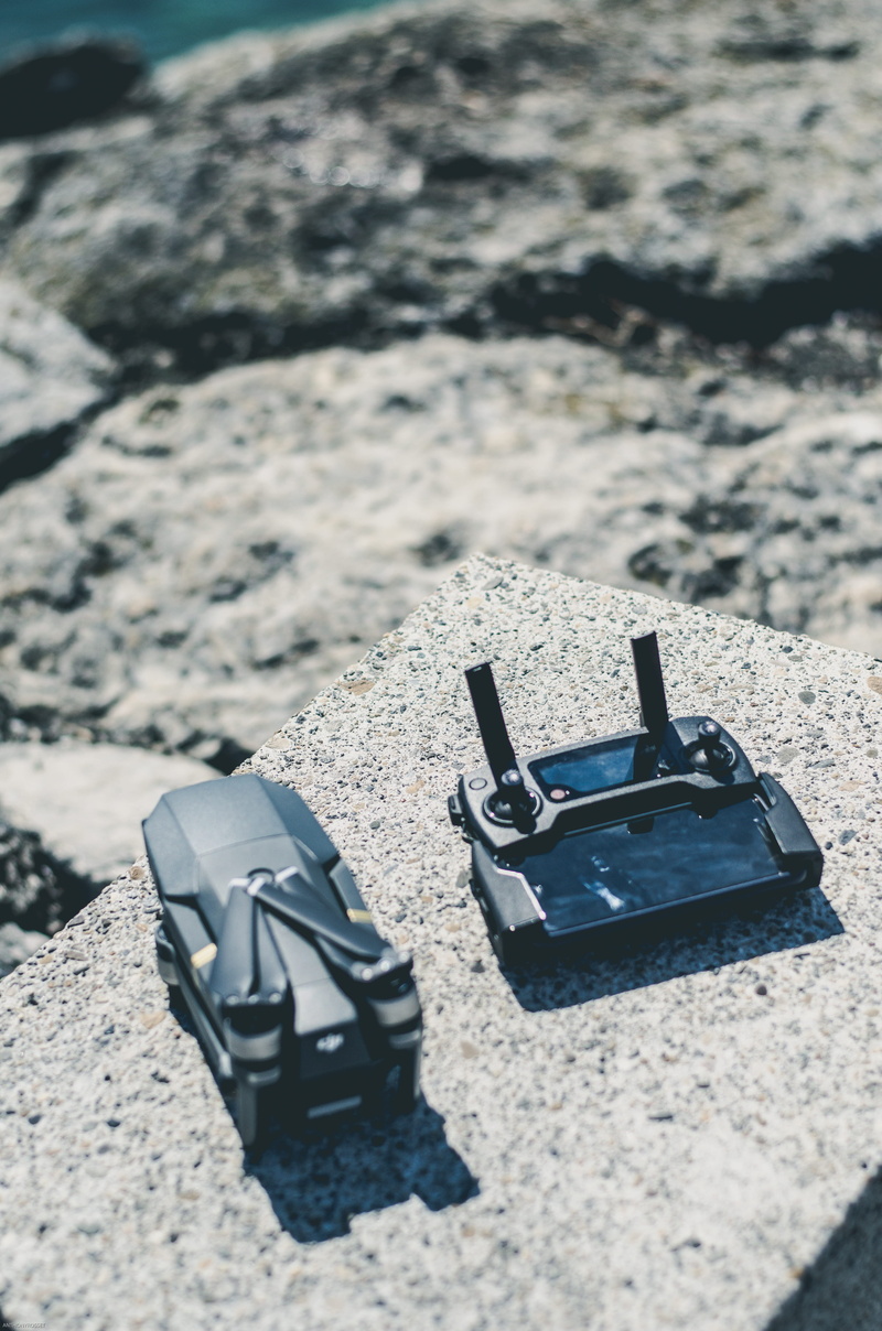 gravel, nikon, mavicpro, spoke, dirt road, machine, personal accessory, solid, ring, land, absence, two objects, controller, mavic, adapter, wristwatch