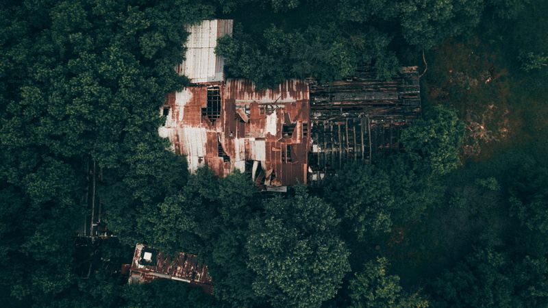 drone view, building exterior, damaged, city, djimavic, rust, eye, houses, wall, plant, no people, view, ruin, architecture, aerial, outdoors, trees, overgrown