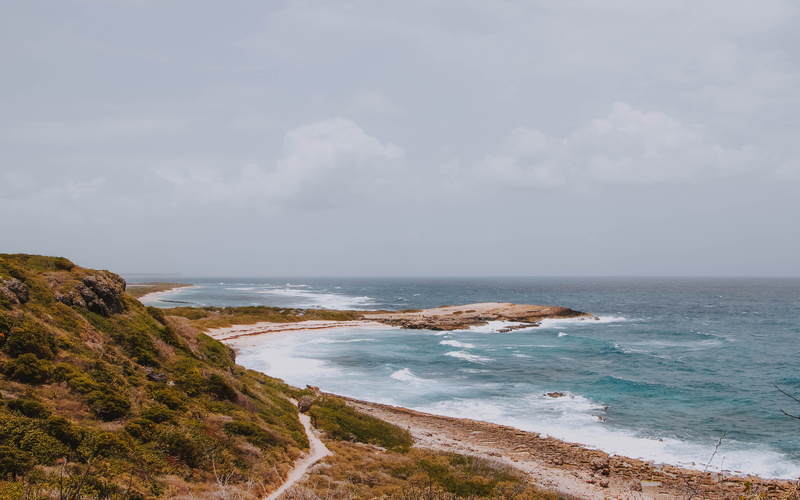 outdoors, non-urban scene, tower, shoreline, horizon, land, travel, summer, beauty in nature, beach, no people, sea, nature, promontory, ocean, tranquility