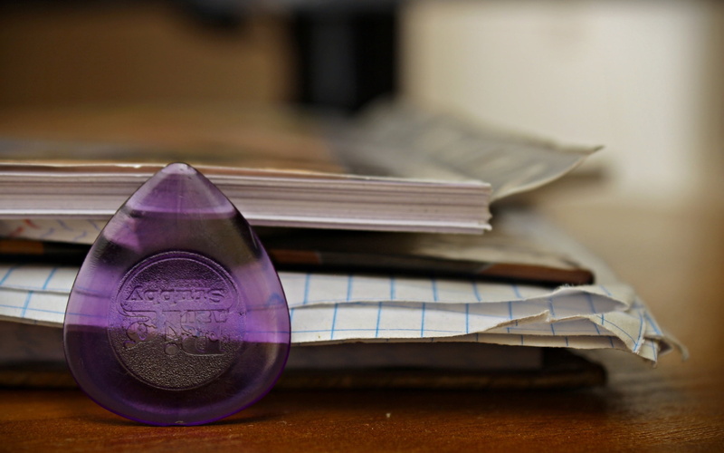 textile, indoors, book, table, focus on foreground, wealth, close-up, page, sheets, still life, stack, paper, publication, selective focus, education, glass - material