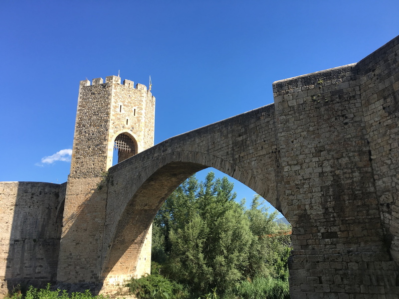 stone bridge, bridge - man made structure, low angle view, bridge, history, the past, outdoors, arch, stone wall, building exterior, tree, arch bridge