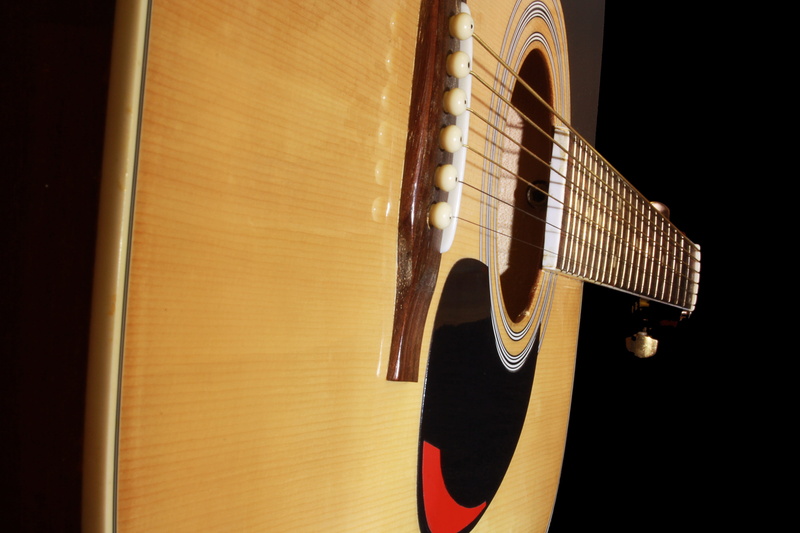 black background, stringed instrument, fretboard, guitar, guitar federal, instrument, focus on foreground, single object, still life, guitar head, wood - material