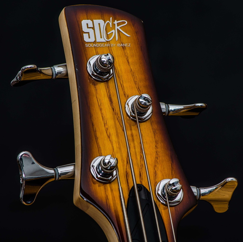 musical equipment, guitar neck, guitar strings, still life, bass, musical instrument, text, faucet, headstock, bass guitar, chrome, communication, tuners