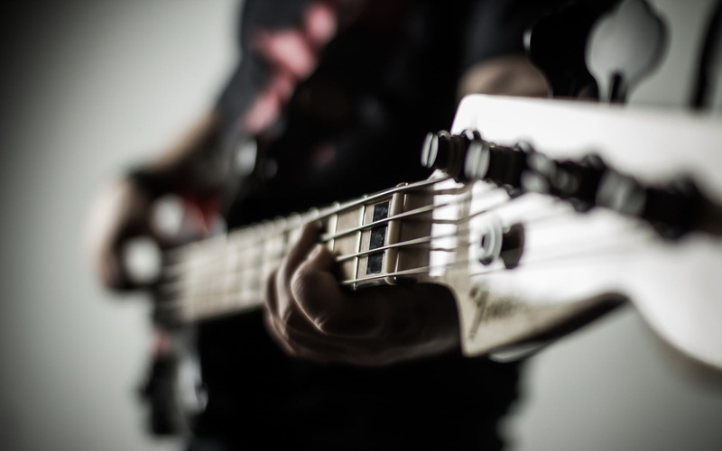 fretboard, indoors, skill, background, wood - Material, sound, one person, studio shot, human Hand, plucking an instrument, color Image, human body part
