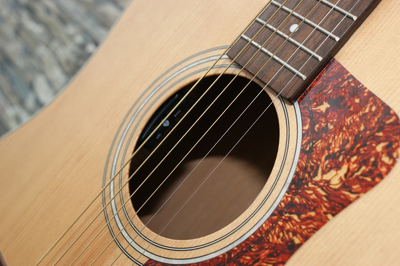 no people, musical instrument string, close-up, musical instrument, guild, acoustic guitar, string, fingerboard, woodwind instrument, music, brown, focus on foreground