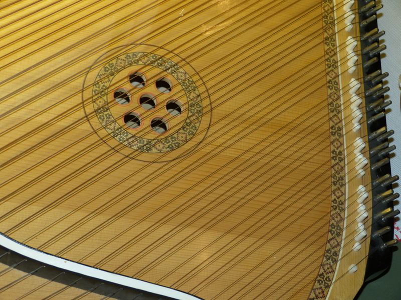 klampfe, representation, 4K, low angle view, design, pattern, Strings, ceiling, outdoors, architecture, musical instrument, yellow, art and craft, String