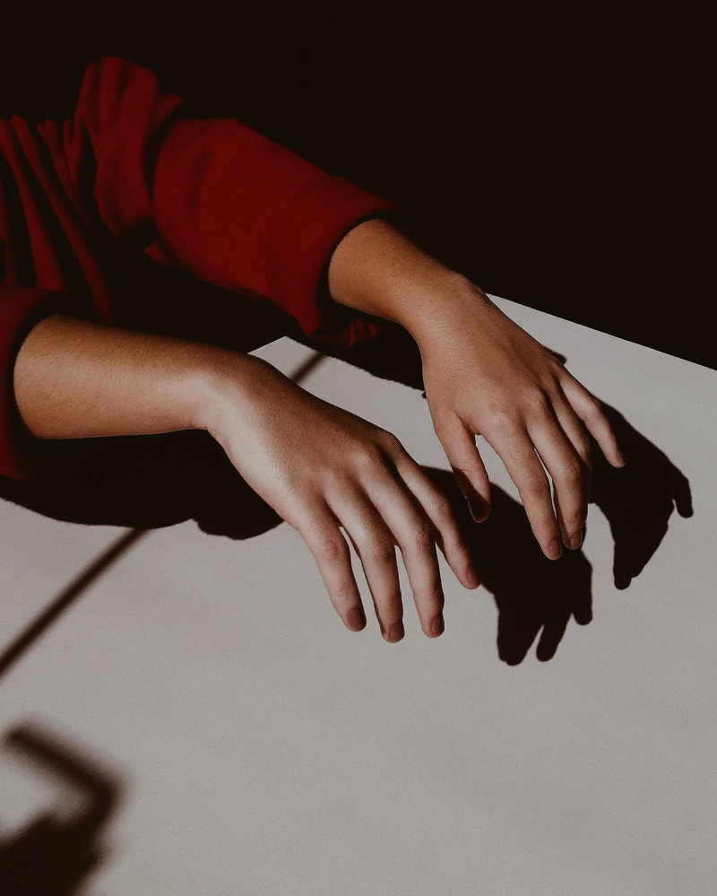s, focus on foreground, unrecognizable person, human finger, shadow, exercising, hand, finger, indoors, human limb, woman, 2K, person, body part, close-up