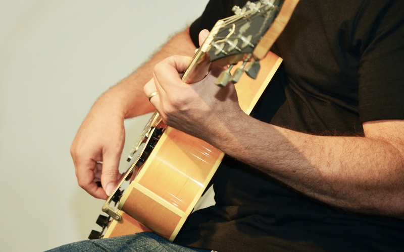 guitar, finger, entertainment, concert, electric guitar, one person, midsection, plucking an instrument, home improvement, human, human hand, musical instrument