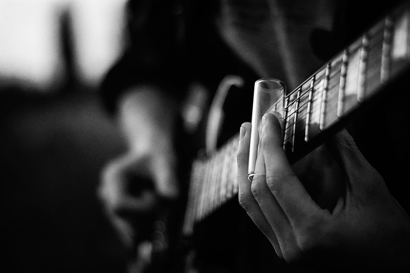 skill, black and white, plucking an instrument, 4K, white, holding, human body part, focus on foreground, music, focus, lifestyles, black, finger, selective