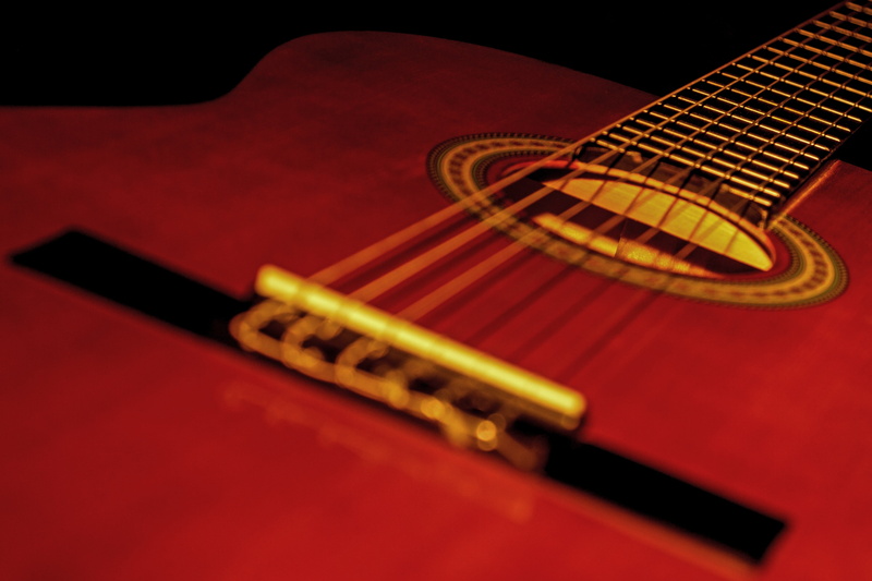 music, string instrument, soundbody, stage, red, indoors, black background, close up, 4K, guitar, musical instrument, performing arts event, classical music
