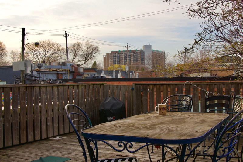 city, plywood, flooring, deck, canal, flagstone, glass, built structure, tree, building, railing, hardwood, dining table, cloud - sky, building exterior