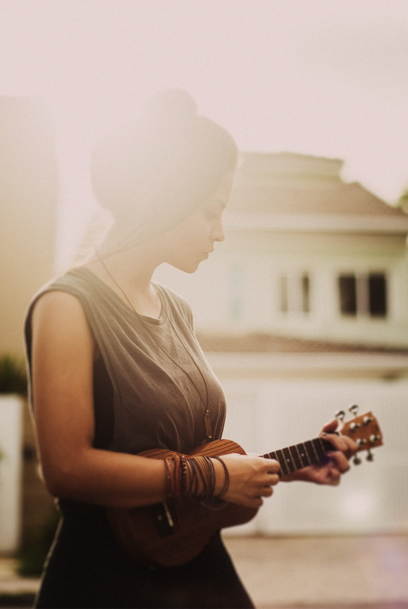 dawn, lifestyles, person, built structure, dress, casual clothing, hairstyle, street, foggy, young adult, ukelele, focus on foreground, architecture, landscape
