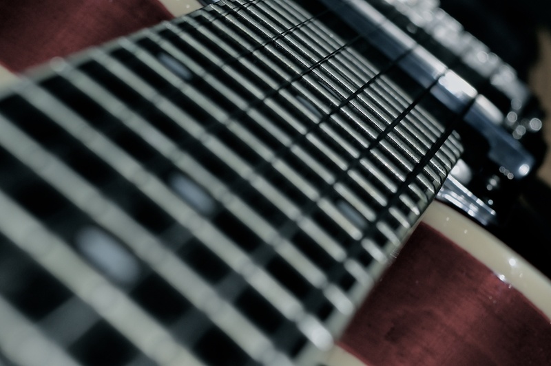 fretboard, humbuckers, computer, black color, indoors, musical, metal, electric, communication, neck, focus on foreground, selective focus, fingerboard