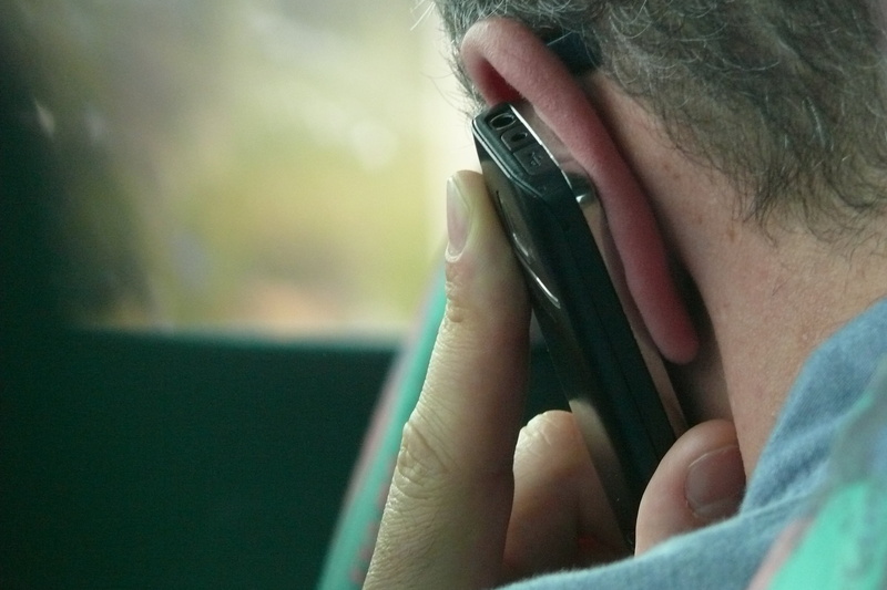 headshot, person, apparatus, talk, exchange of information, one Person, technology, communicate, focus on foreground, headphones, contact, telephone, listening