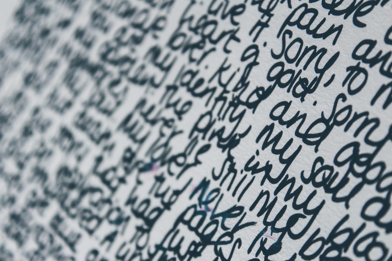 western script, full frame, mammal, jaguar, text, shovel, letter, low angle view, pattern, communication, scroll, page, leopard, black color, calligraphy