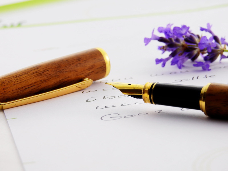indoors, black, writing tool, flowering plant, fountain pen, filler, letters, text, blossom, quill, publication, studio shot, desk, communication, freshness
