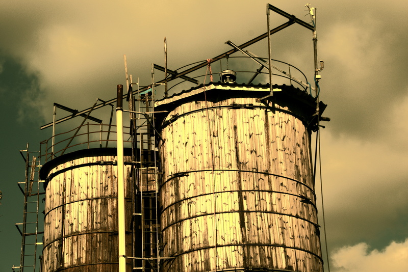 sky, landscape, industry, wood silo, low angle view, mood, industrial equipment, store, refueling, cloud - sky, agriculture, fuel storage tank, pollution