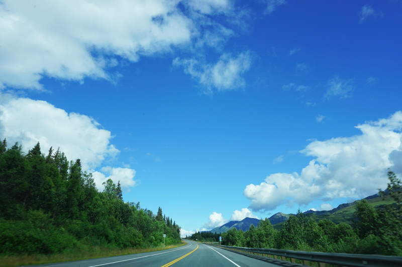 diminishing perspective, cloud - sky, outdoors, blue, scenics - nature, plant, alaska, lines, sign, nature, tranquility, crash barrier, direction, roads