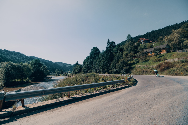 sky, non-urban scene, competition, railing, person, urban, man, the way forward, transportation, beauty in nature, clear sky, tree, bukovel, roadbike, sport