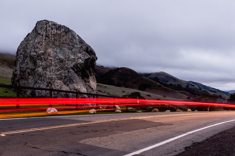 mountain, nature, mode of transportation, multiple lane highway, light, motor vehicle, cloudy, crash barrier, mountains, outdoors, asphalt, street, exposure