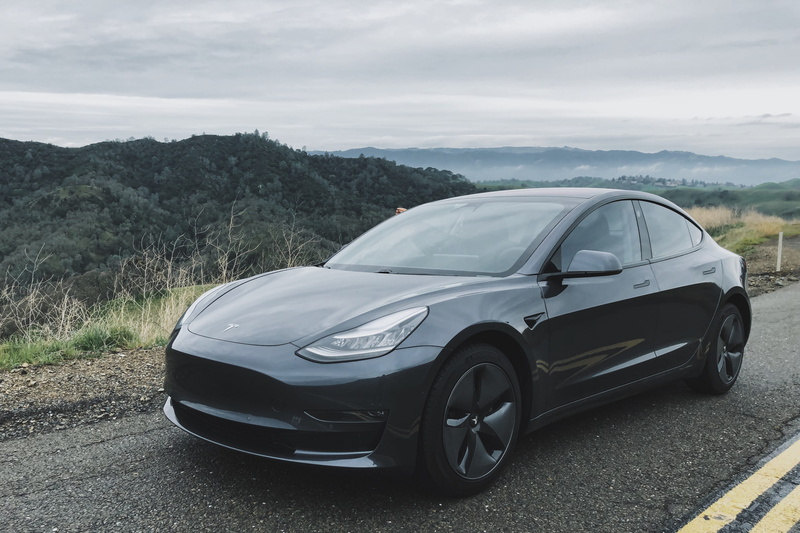 no people, sky, car, travel, machine, united states, outdoors, land vehicle, ev, sedan, alloy wheel, stationary, tesla, mode of transportation, vehicle