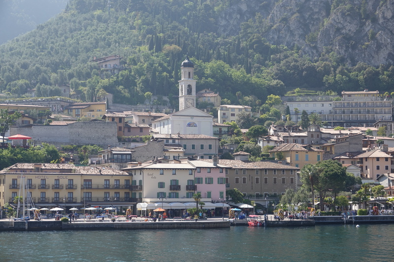 tree, nautical vessel, limone, cityscape, building exterior, day, mountain, outdoors, built structure, city, mode of transportation, building, transportation