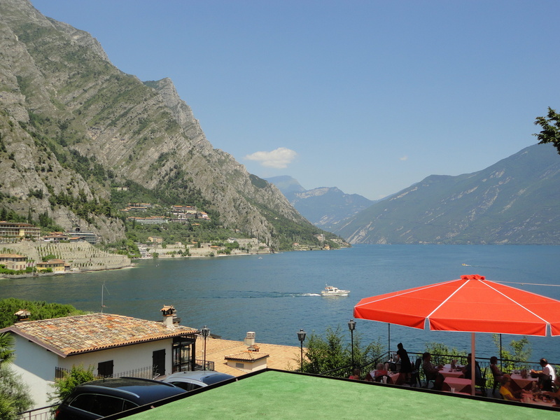 outdoors, sunlight, mountain, day, sky, clear sky, 4K, umbrella, italy, blue, lake, travel destinations, building, mountain range, nature, garda, scenics - nature