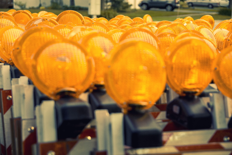road signs, food and drink, lighted warning sign, lighted road sign, lit road stand, store, industry, focus on foreground, orange signs, 5K, yellow signs