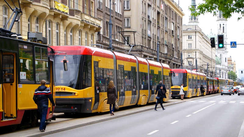 people, yellow, motion, track, cable car, group of people, built structure, train, the stopper, outdoors, women, Street, building exterior, Tram, black
