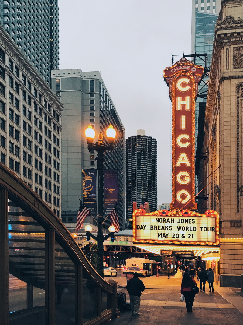 street, architecture, tall - high, outdoors, office building exterior, theater, nature, skyscraper, real people, illuminated, street light, chicago loop