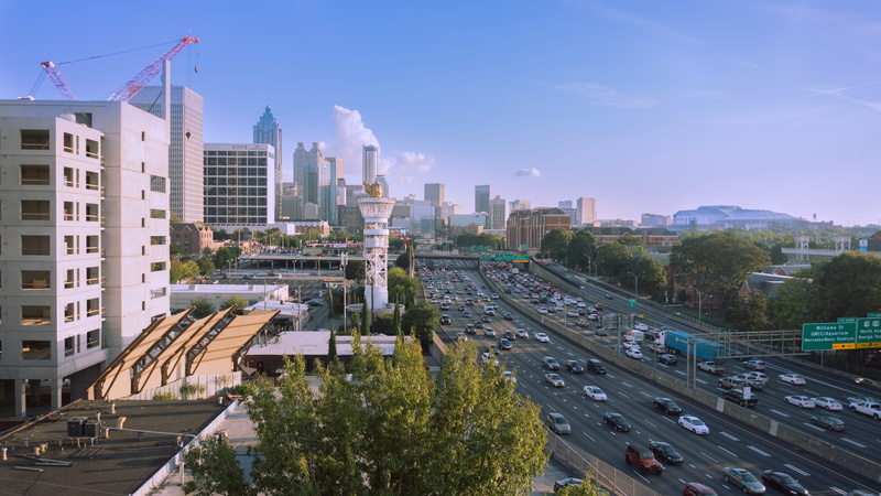 residential district, road, midtown, car, bright, transportation, tree, outdoors, building exterior, no people, financial district, modern, traffic, high angle view