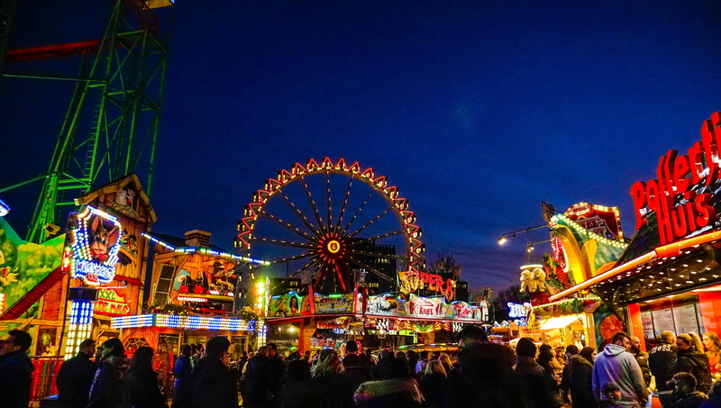 people, rollercoaster, illuminated, motion, outdoors, fun, fun fair, crowd, excitement, nightlife, christmas market, night, city, traveling carnival, arts culture and entertainment