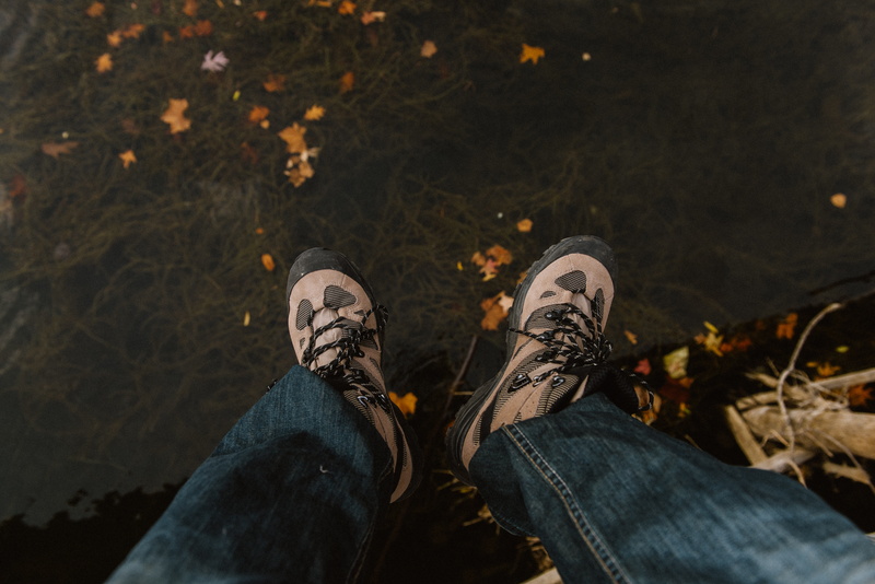 fall, water, shoe, lifestyles, one person, shoes, standing, low section, leisure activity, outdoors, 5K, human body part, leaves, human leg, change, jeans