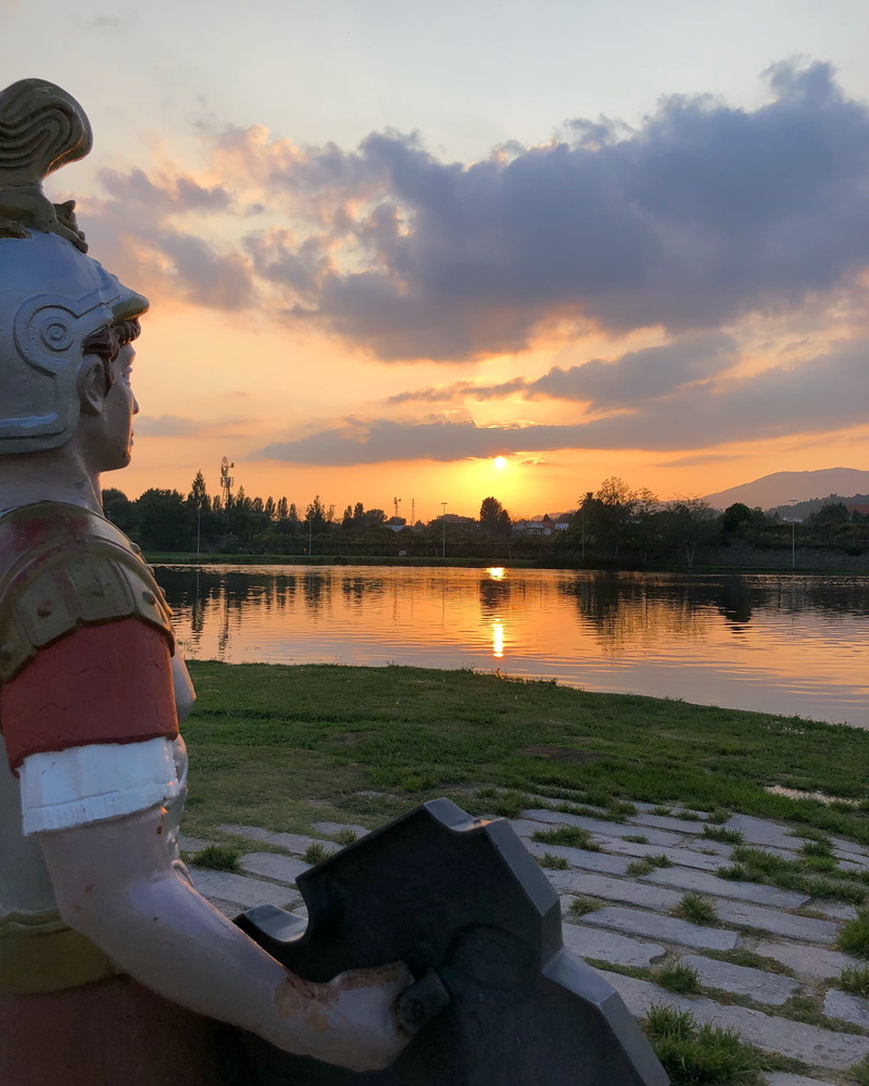 portugal, human representation, orange color, representation, looking at view, 2K, art and craft, reflection, cloud - sky, male likeness, lake, nature