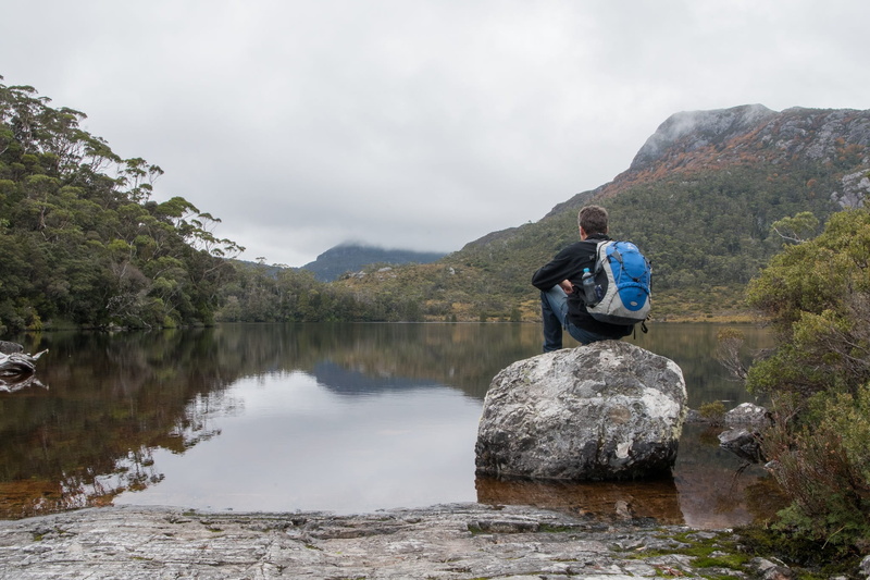 adults only, activity, tranquil scene, one person, sitting, lifestyles, 1080P, solid, Tasmania, full length, lake lilla, mountain range, mountain, Cradle Mountain