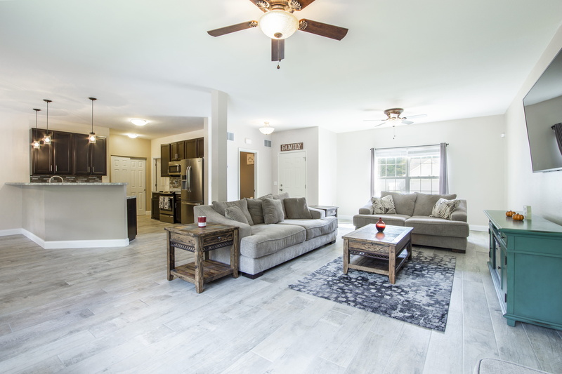 area, furniture, seat, wealth, ceiling, home showcase interior, white color, room, no people, electric lamp, flooring, luxury, indoors, couch, living room