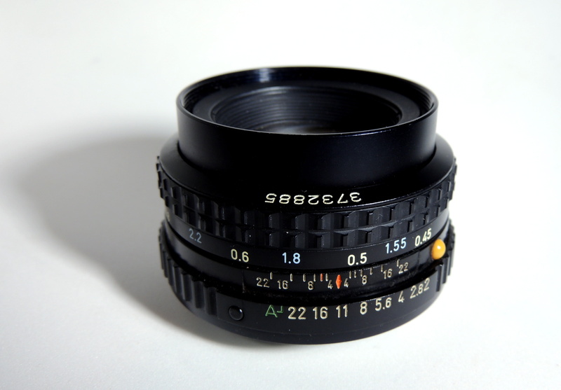 number, slr camera, studio shot, lens - optical instrument, camera - photographic equipment, single object, black color, former, close-up, camera, technology