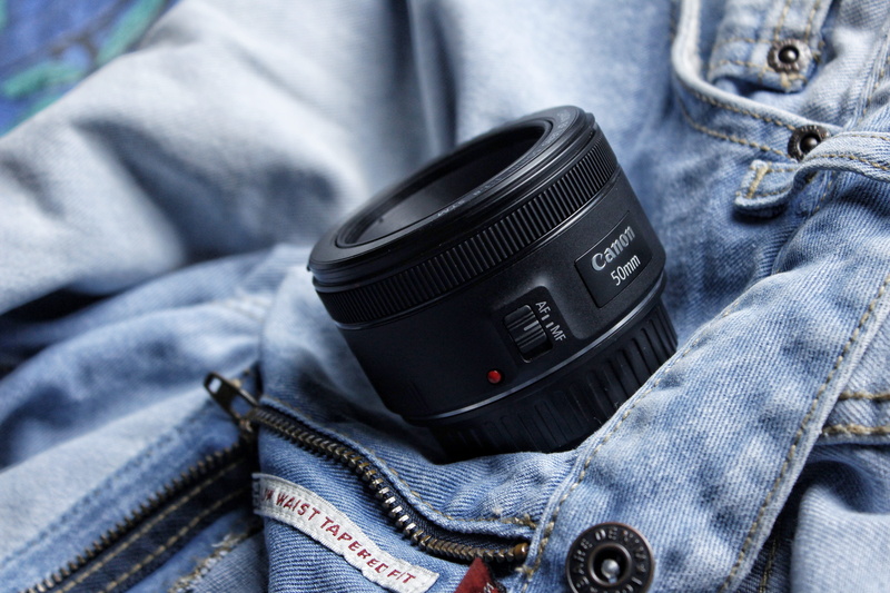midsection, human body part, bottoms, motor vehicle, camera, safety, belt, 50mm, technology, men, lens, adult, blue, jeans, clothing, transportation, mm