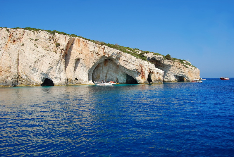 nature, waterfront, bay, rock formation, blue, architecture, sky, mediterranean, nautical vessel, the sun, built structure, caves, greece, day, summer
