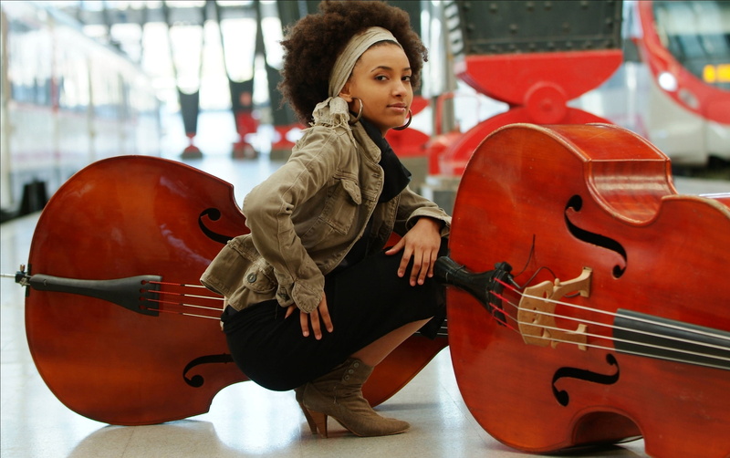 black, hairstyle, real people, one person, lifestyles, casual clothing, esperanza, s, young women, american, string instrument, musician, arts culture and entertainment