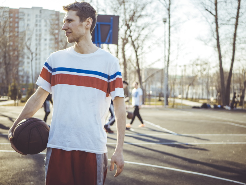 4K, sport, playing, lifestyles, holding, young adult, three quarter length, sportsman, trees, day, sports clothing, group, casual clothing, architecture