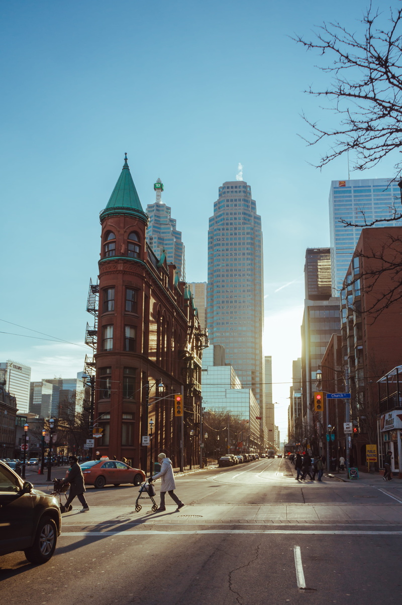 outdoors, motor vehicle, toronto, road, tower, sunlight, building exterior, building, city, street, mode of transportation, skyscraper, canada, office building exterior