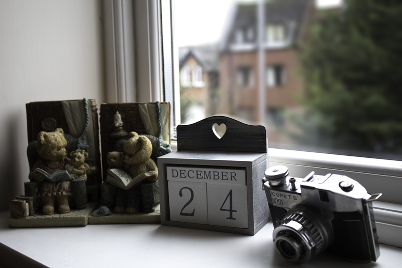 large group of objects, close-up, day, still life, western script, indoors, transparent, camera - photographic equipment, no people, label, food and drink
