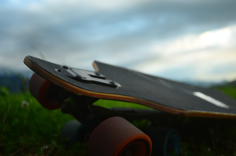 outdoors, skateboarding, close-up, no people, skateboard, field, 2K, rifle, land, wood - material, sky, macro, cloud - sky, air vehicle, military, weapon