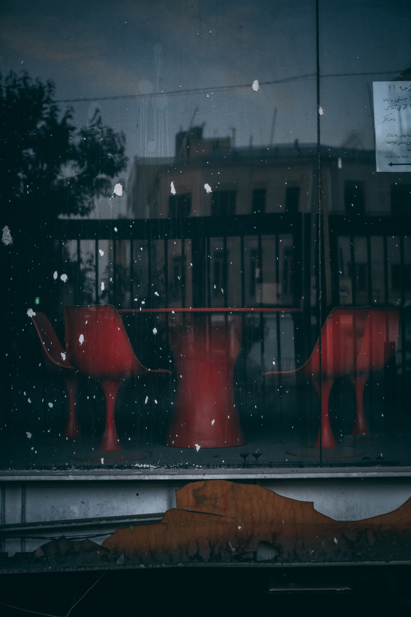 window reflection, land vehicle, built structure, rainy season, piece, gate, left behind, city, transportation, near, old vibe, table, vehicle interior