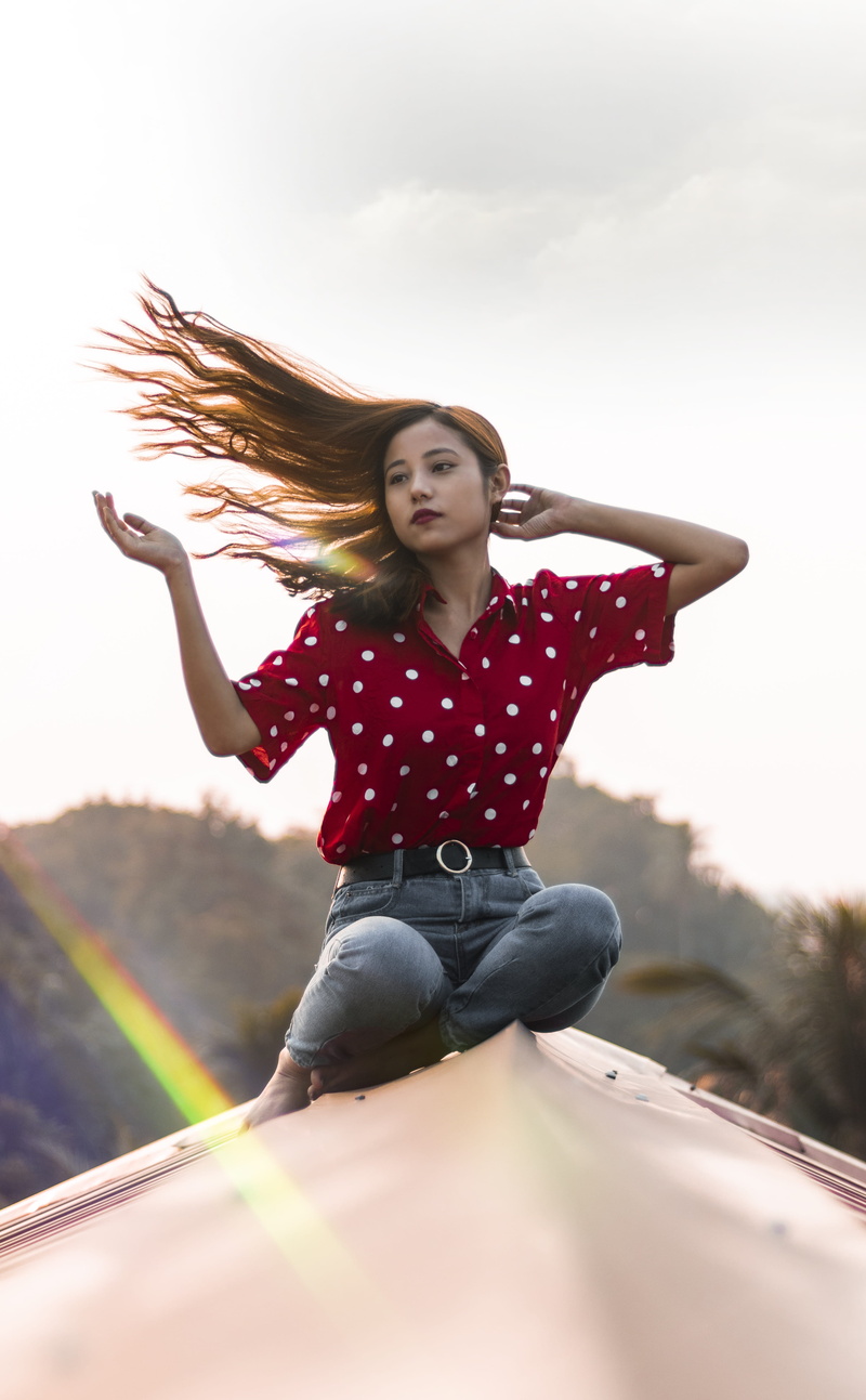 polka, casual clothing, top, white, celebrity, real people, human arm, beautiful woman, motion, outdoors, day, hair, nature, moody, red, lifestyles, one person