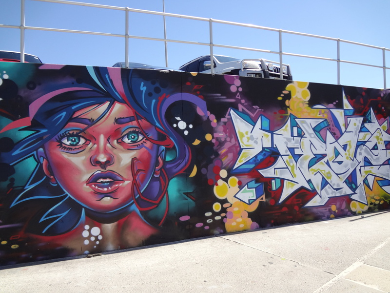 graffiti, bondi beach, mural, street art, multi colored, wall - building feature, building exterior, art and craft, female likeness, sunlight, built structure