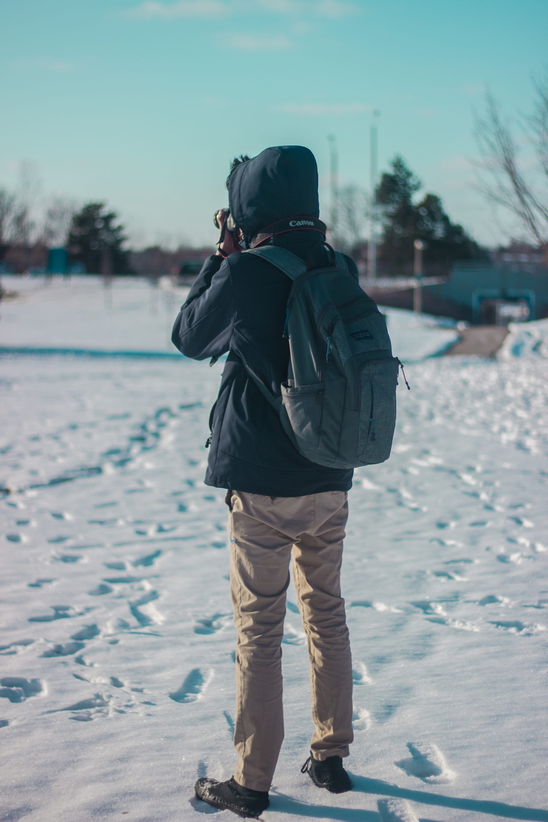canon, rear view, full length, toronto, lifestyles, land, covering, snow, cold temperature, lake, canada, real people, hood - clothing, white, warm clothing