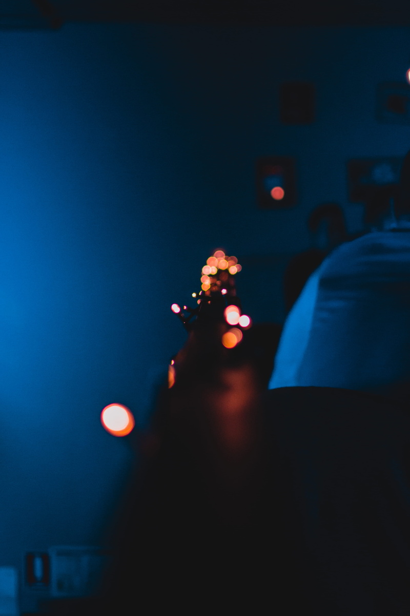 4K, glowing, dark, led, orange, street, lighting equipment, neon, illuminated, vibrant, technology, holding, men, city, human body part, lights, electric