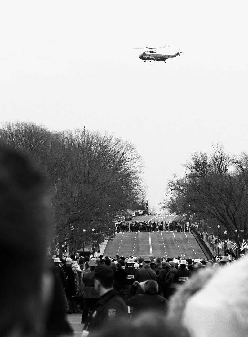 black, city, women, large group of people, person, day, human, pennsylvania avenue, focus on background, white, helicopter, air, real people, president obama over pennsylvania avenue
